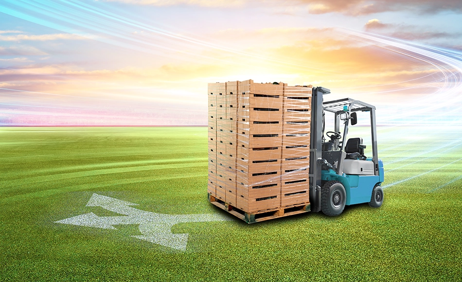 Operator inspects boxes secured with Tama netwrap on a pallet wrapping machine using ventilation wrap